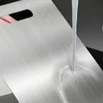 Hygienic metal chopping board after mechanical buffing and knife mark smoothing